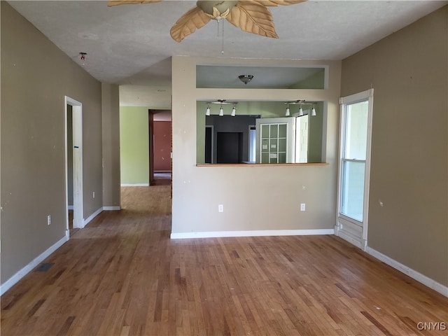 unfurnished living room featuring wood-type flooring