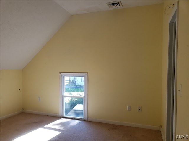 bonus room featuring lofted ceiling and light colored carpet