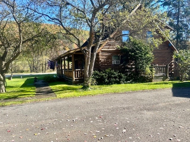 view of property exterior featuring a yard