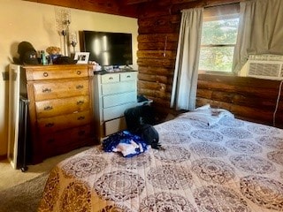 bedroom with cooling unit and rustic walls