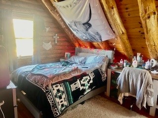 bedroom featuring wooden walls