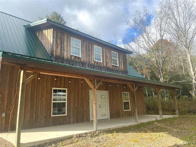 6197 Windfall Rd, Angelica, NY 14813 - view of front facade with metal roof and board and batten siding
