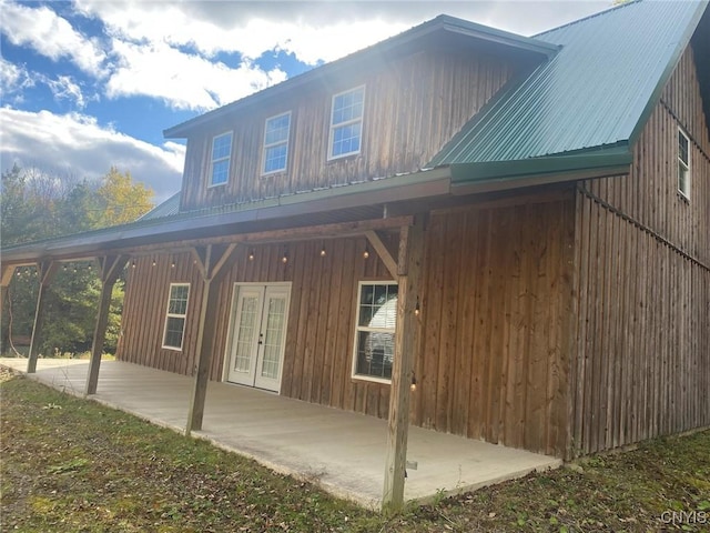 6197 Windfall Rd, Angelica, NY 14813 - back of house with metal roof, a patio area, and french doors