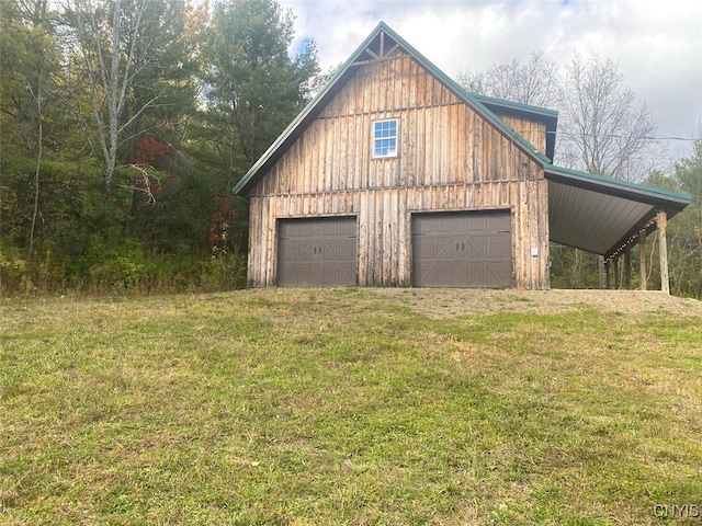 garage with a lawn