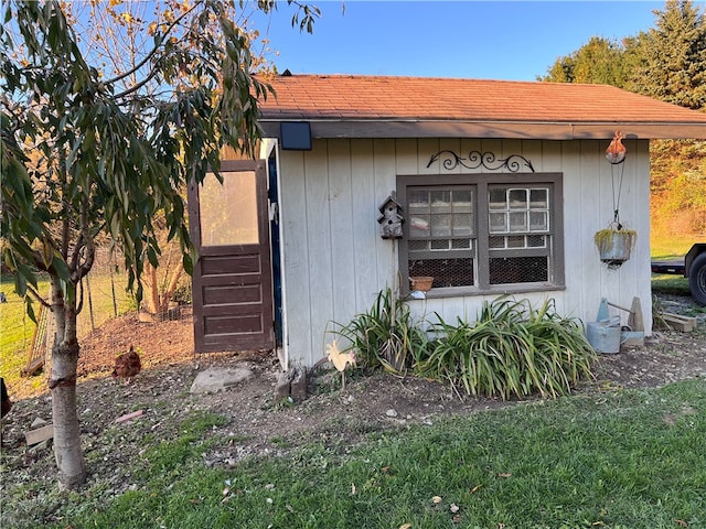 view of home's exterior with an outdoor structure