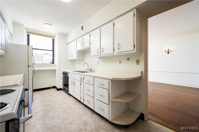 kitchen featuring black dishwasher, sink, light wood-type flooring, white electric stove, and white cabinetry