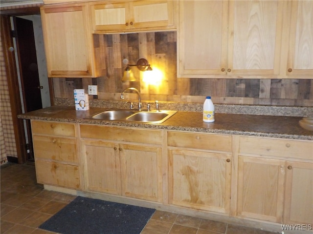 kitchen featuring light brown cabinetry and sink