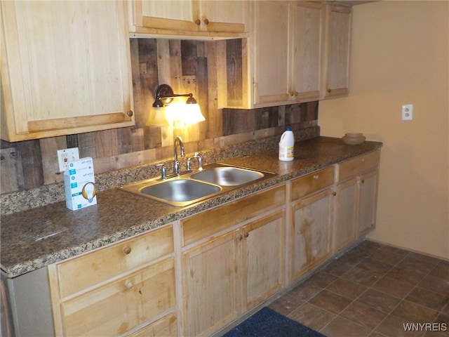 kitchen featuring sink and light brown cabinetry