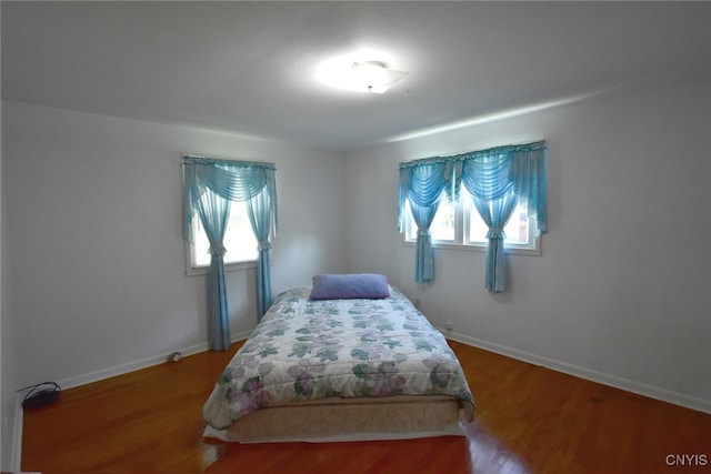 bedroom featuring wood-type flooring