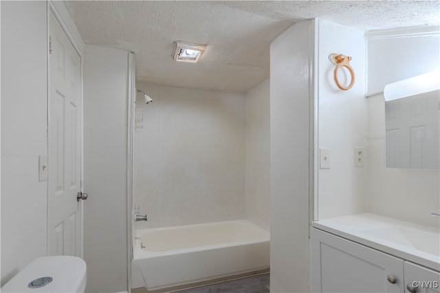 full bathroom featuring bathtub / shower combination, wood-type flooring, a textured ceiling, toilet, and vanity