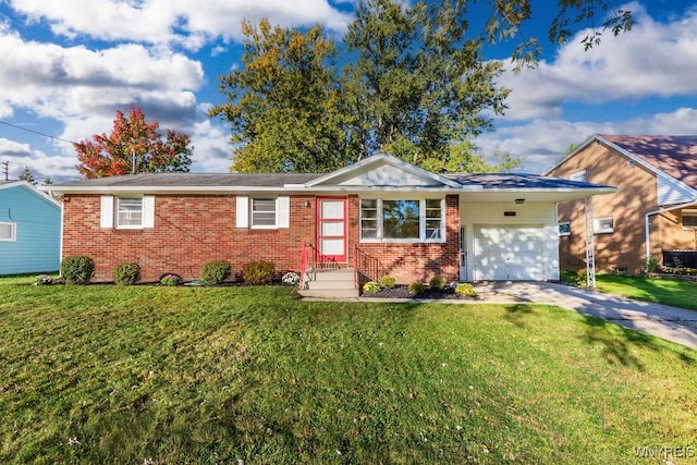 ranch-style home featuring a front lawn and a garage