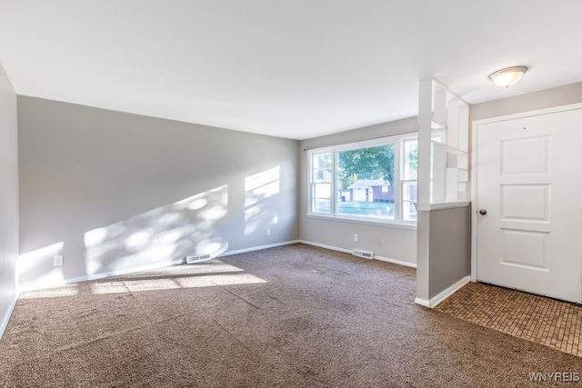 view of carpeted foyer