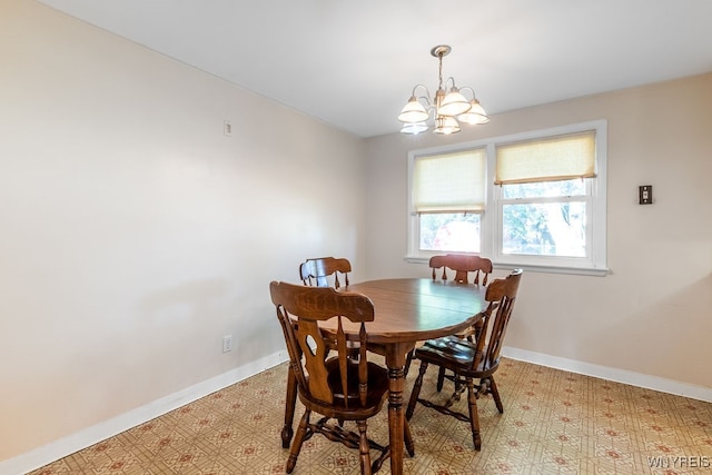 dining space featuring a chandelier