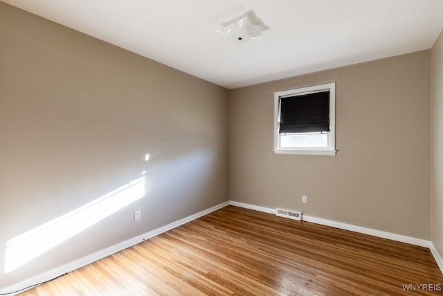 unfurnished room featuring wood-type flooring