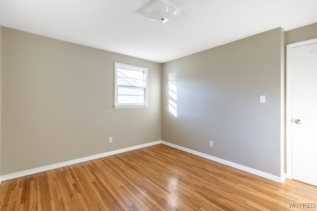 unfurnished room featuring light hardwood / wood-style floors