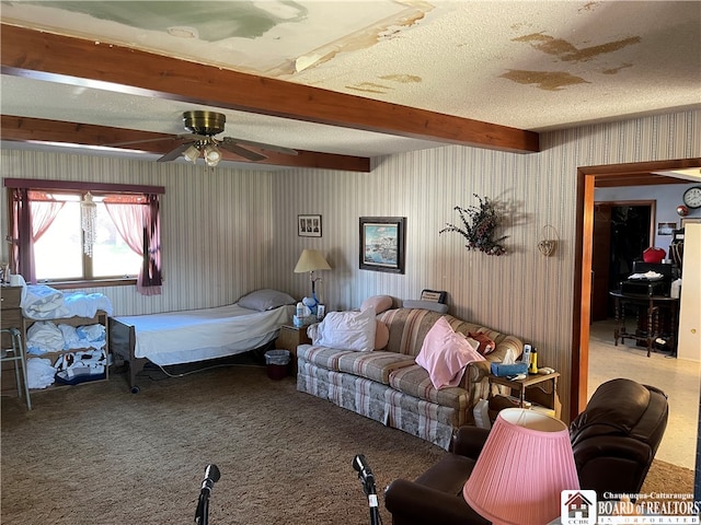 carpeted bedroom with beamed ceiling, a textured ceiling, and ceiling fan