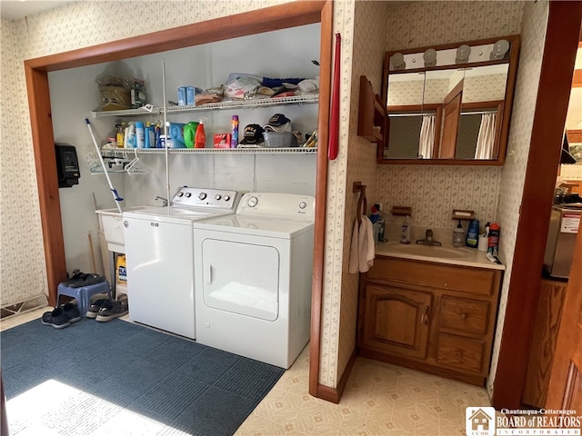 washroom with washing machine and clothes dryer