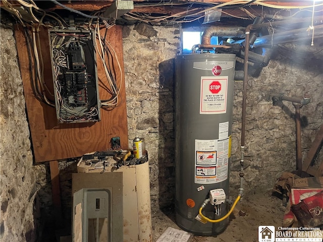 utility room with water heater and electric panel