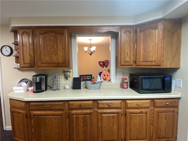 kitchen with a notable chandelier and decorative light fixtures