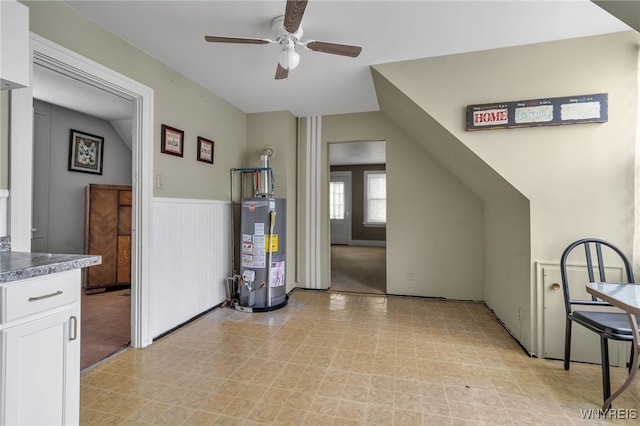 bonus room with water heater, vaulted ceiling, and ceiling fan