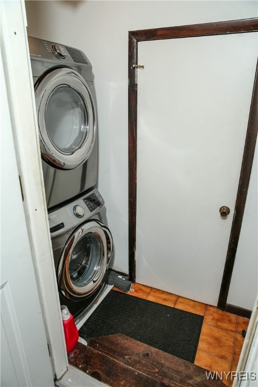 clothes washing area featuring stacked washer / drying machine