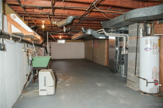 basement featuring sink, gas water heater, and heating unit