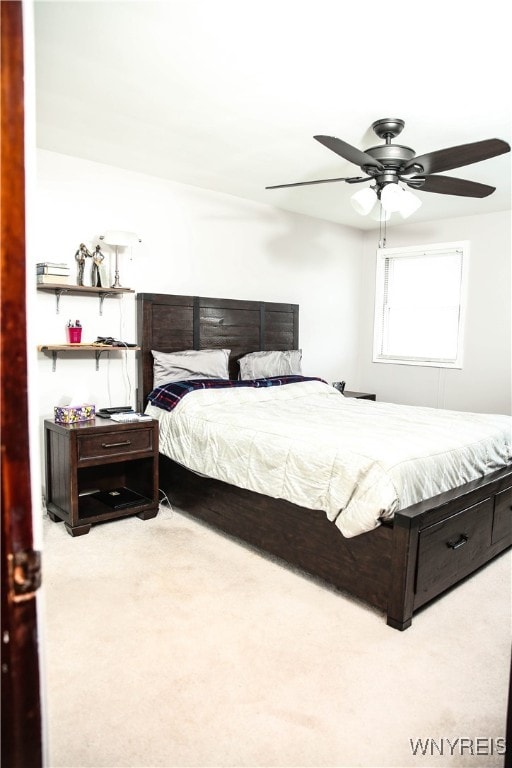 carpeted bedroom featuring ceiling fan