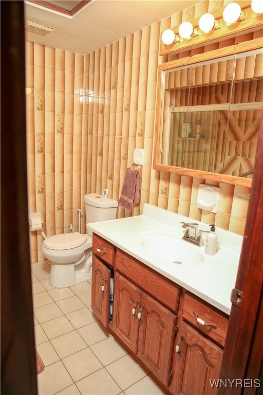 bathroom with vanity, toilet, and tile patterned flooring