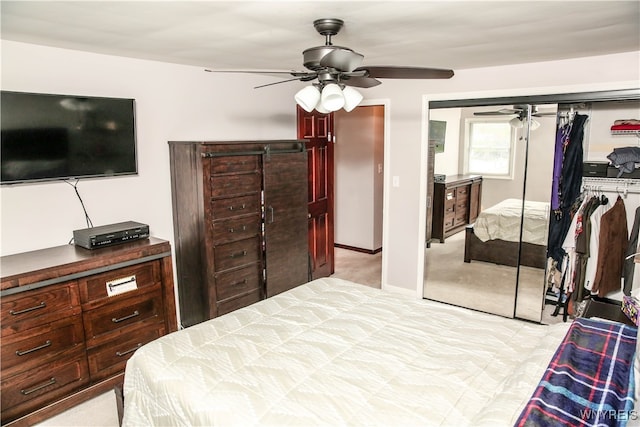 carpeted bedroom featuring a closet and ceiling fan