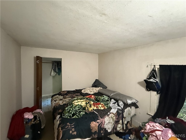 bedroom featuring a textured ceiling