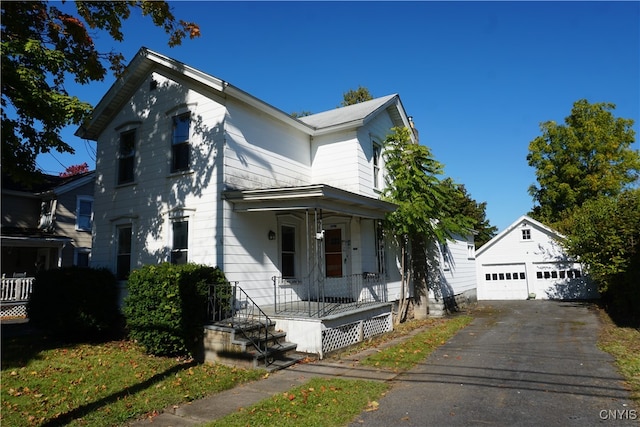 view of front of house with an outbuilding and a garage