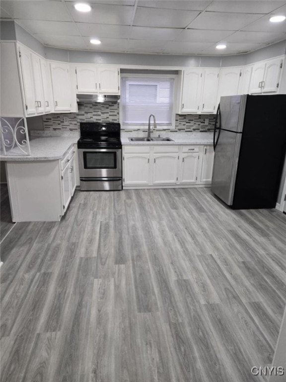 kitchen featuring light hardwood / wood-style floors, white cabinetry, stainless steel appliances, and sink