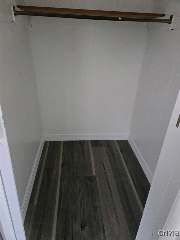 walk in closet featuring dark hardwood / wood-style flooring