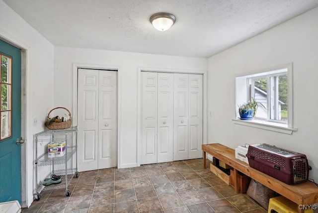 interior space featuring a textured ceiling