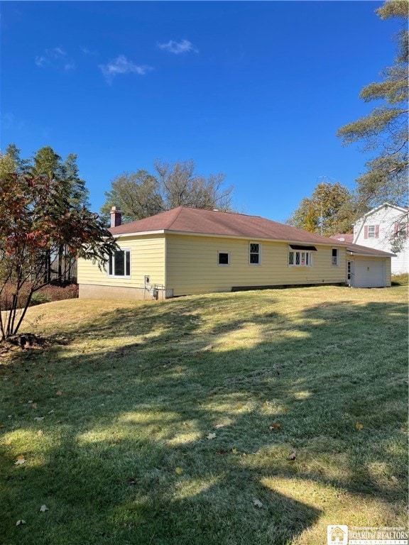 view of home's exterior featuring a lawn