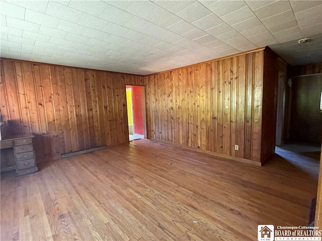 interior space featuring wood walls and wood-type flooring