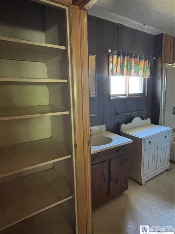 bathroom featuring vanity and concrete flooring