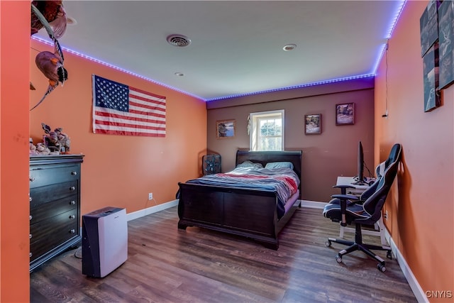 bedroom featuring dark hardwood / wood-style flooring