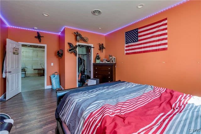 bedroom featuring ornamental molding and dark hardwood / wood-style floors