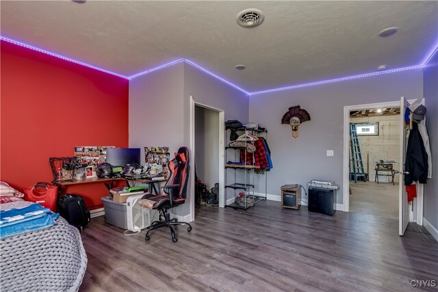 bedroom featuring crown molding and hardwood / wood-style flooring