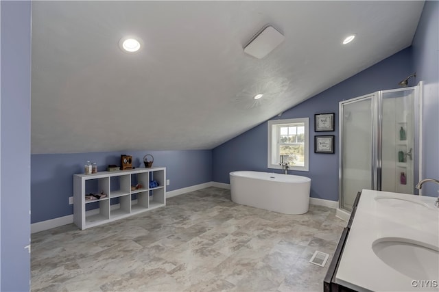 bathroom with vanity, independent shower and bath, and vaulted ceiling