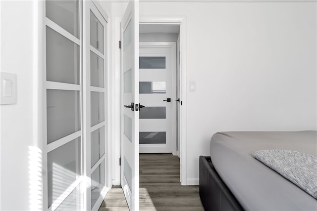 bedroom featuring dark hardwood / wood-style flooring