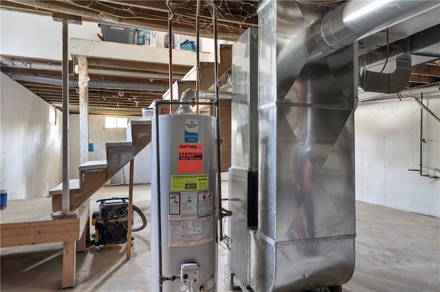 utility room with gas water heater and heating unit