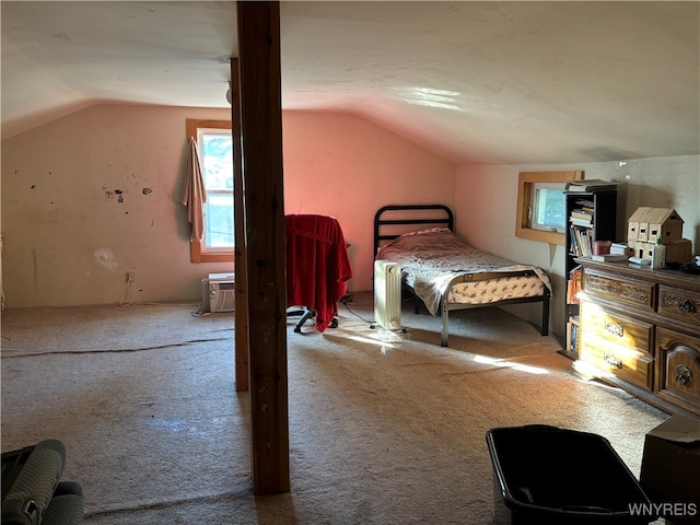 bedroom featuring carpet and vaulted ceiling