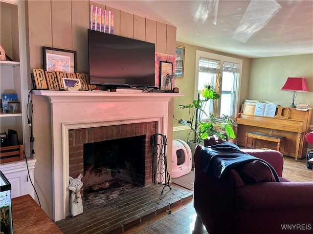 living room featuring light hardwood / wood-style floors and a fireplace