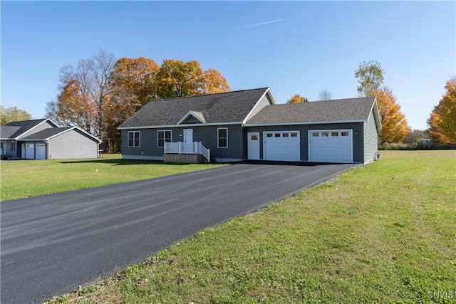 ranch-style house with a front lawn and a garage