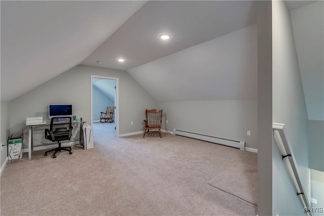 office area featuring light carpet, lofted ceiling, and a baseboard heating unit