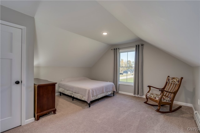 bedroom with vaulted ceiling, light carpet, and a baseboard heating unit