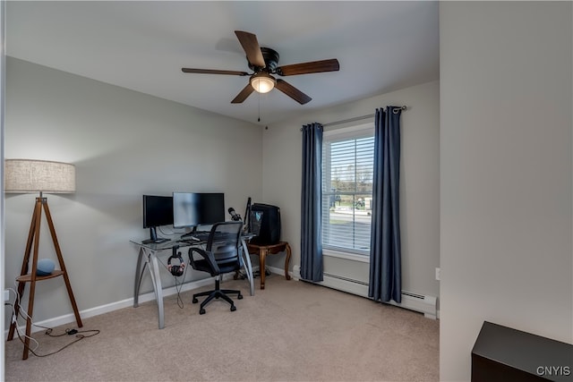 carpeted office space with a baseboard heating unit and ceiling fan