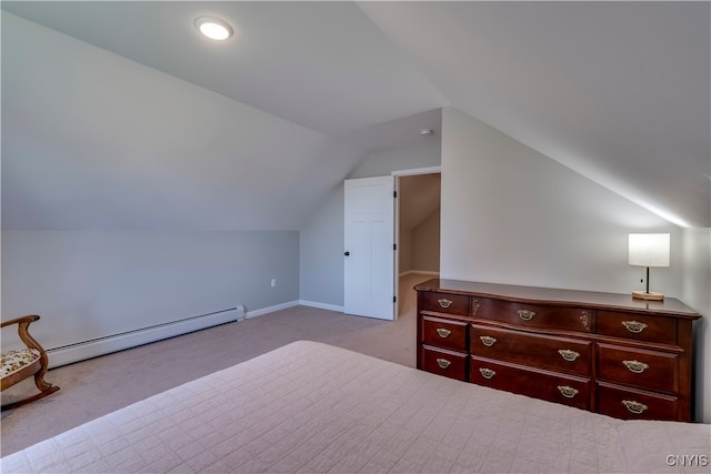 unfurnished bedroom with a baseboard radiator, vaulted ceiling, and light carpet